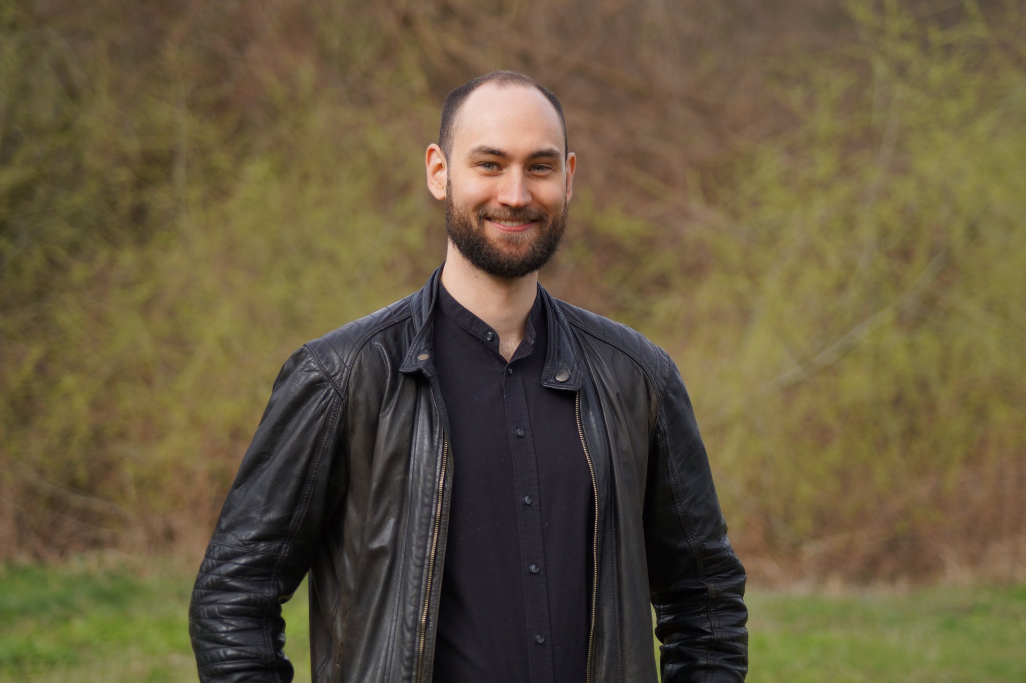 Frederik Hahn smiling and wearing a black jacket