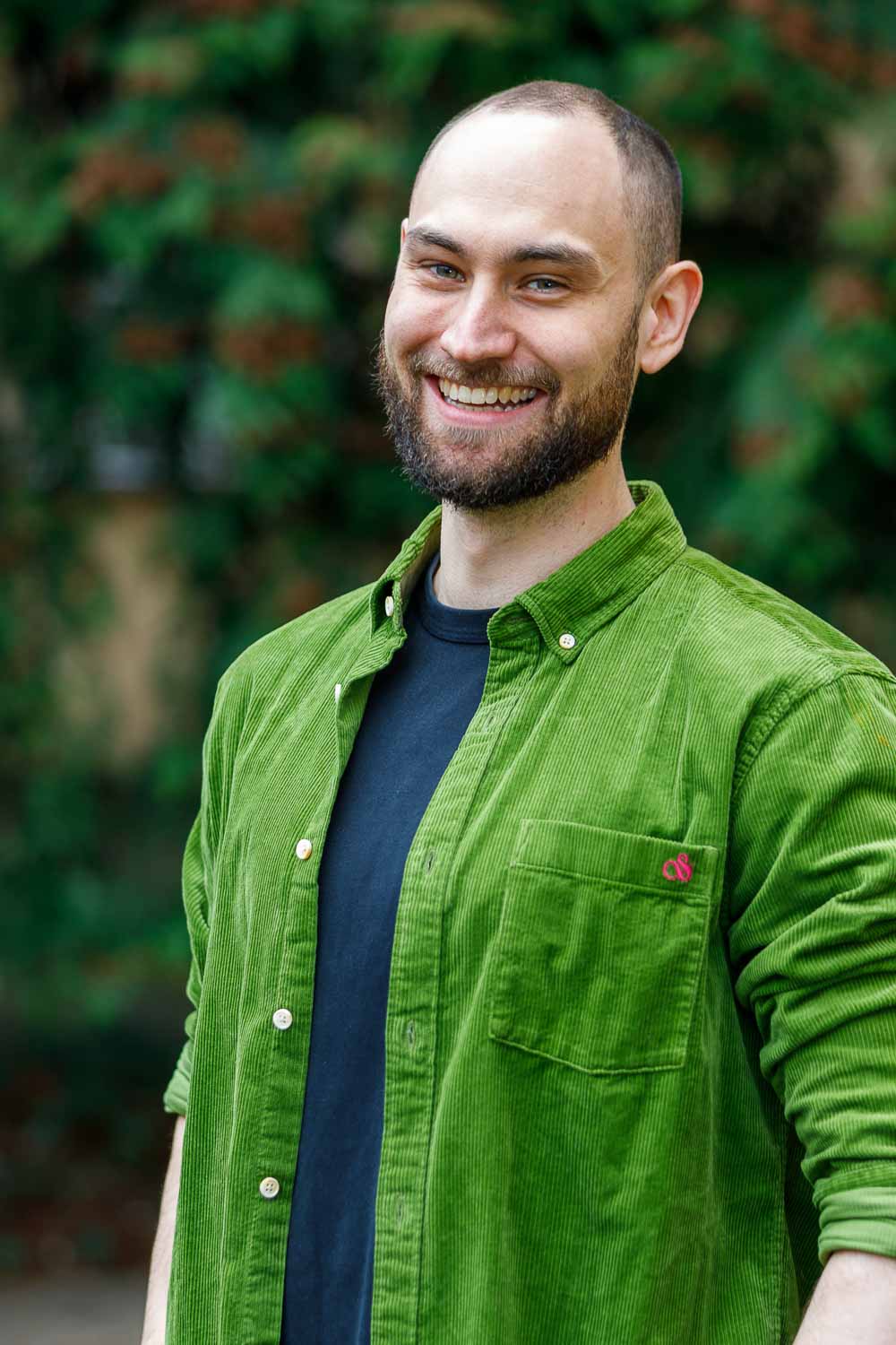 Frederik Hahn smiling and wearing a green shirt
